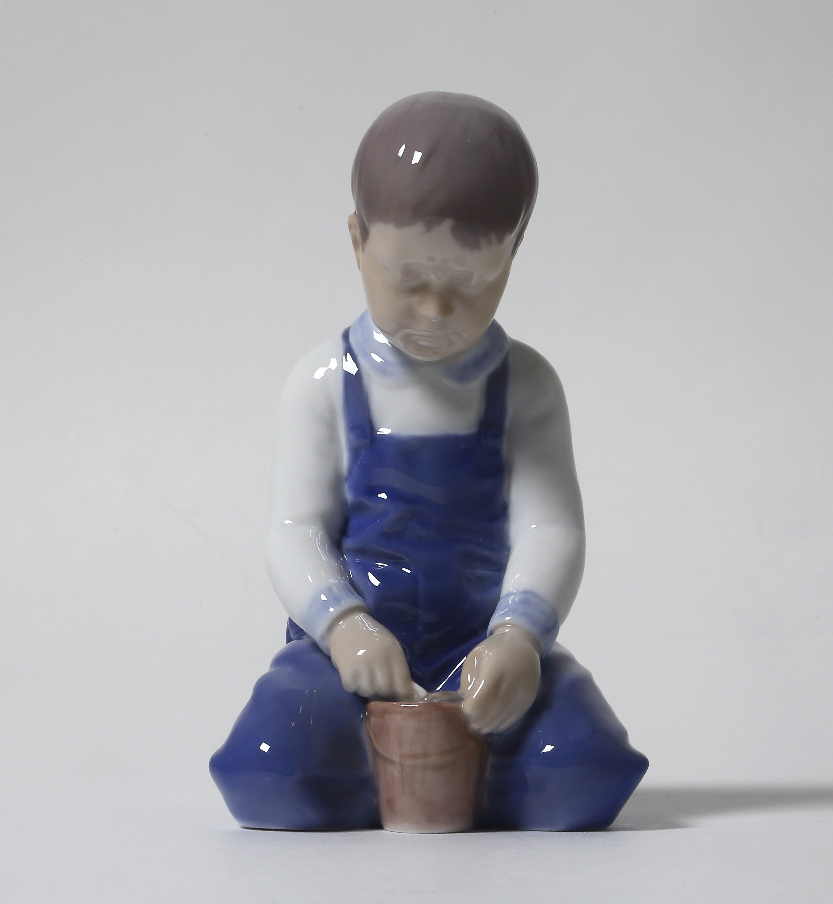 "Boy with a bucket. Denmark, Copenhagen, Bing & Grondahl."