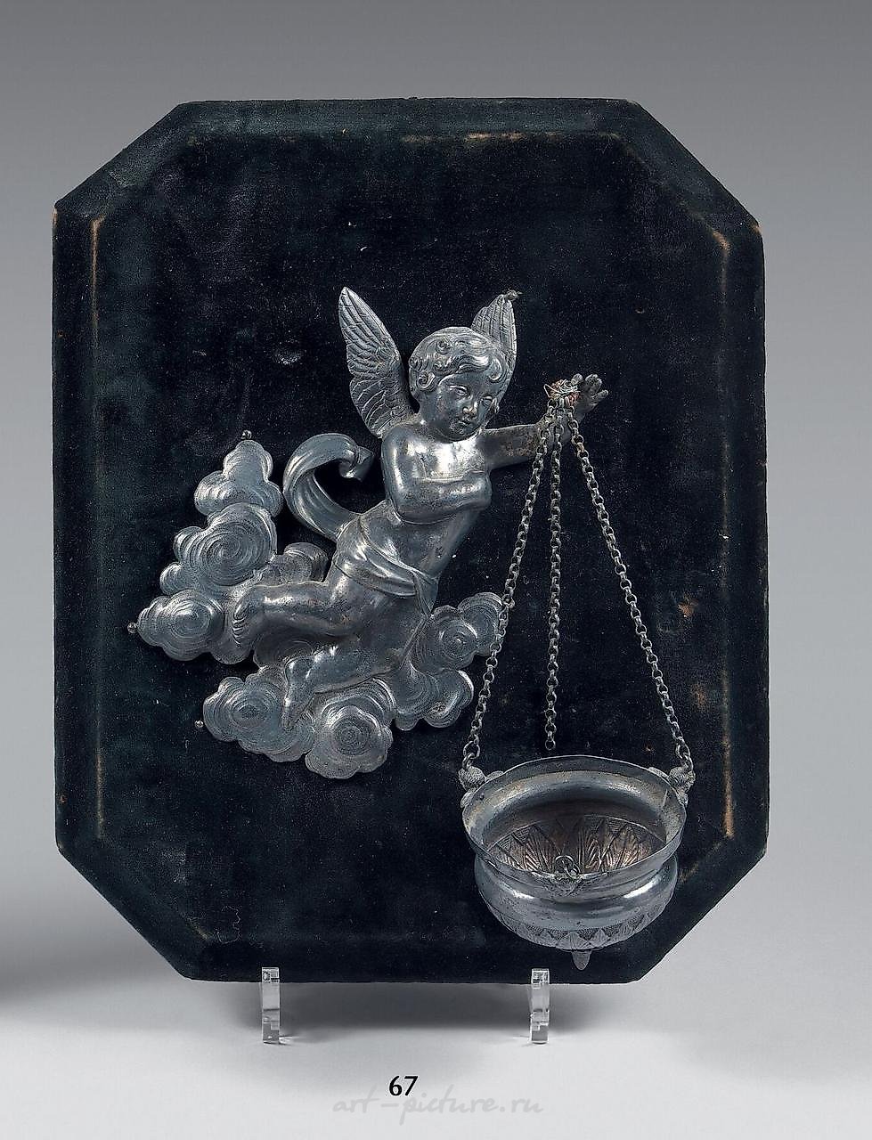 An alcove-shaped silver stoup embossed with a...