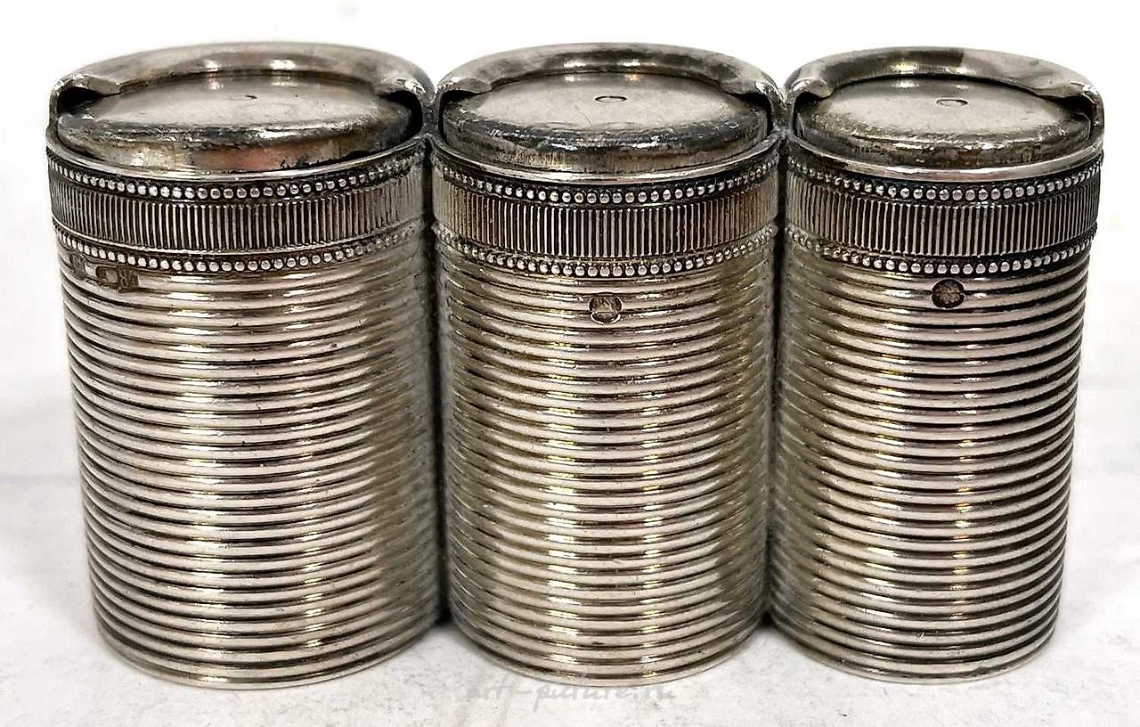 A hallmarked silver coin holder of drum shape, plain polished...