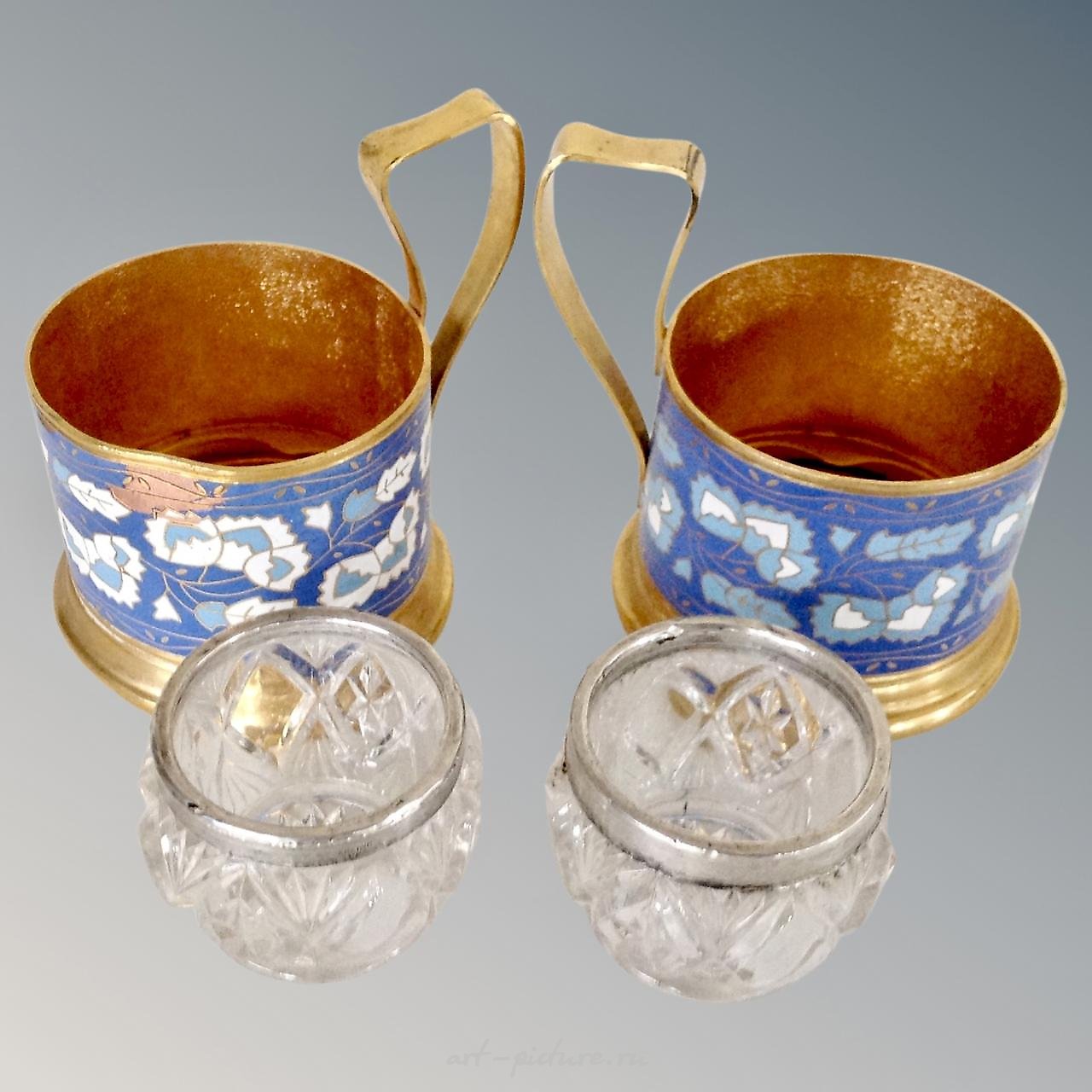 A pair of sterling silver salts with blue glass liners