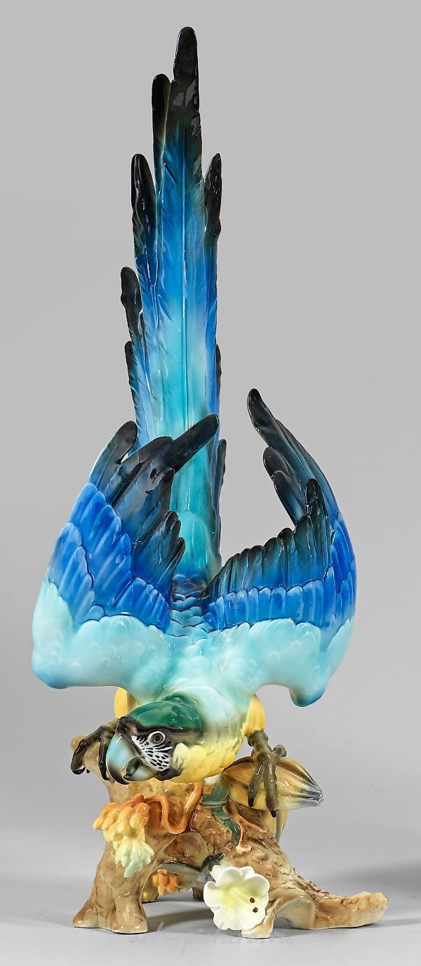 Lot 592: Grand Papagei
In this magnificent piece, we are presented with a grand Papagei, or parrot, captured in all its splendor. The artist skillfully portrays the vibrant colors and intricate details of this majestic creature. The Papagei is depic