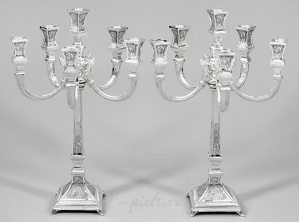A pair of girandoles in the Baroque style.